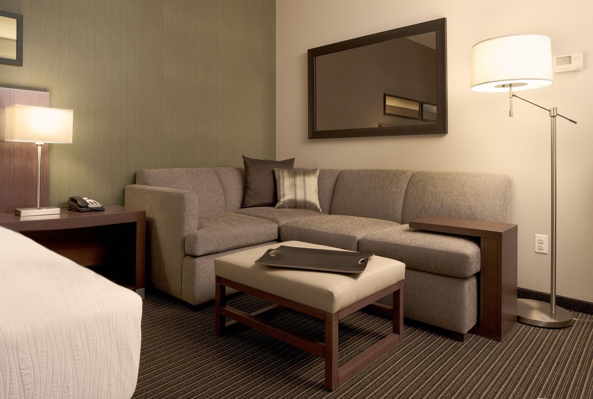 Hyatt Place Gurgaon Udyog Vihar Exterior photo A living room in a typical hotel room